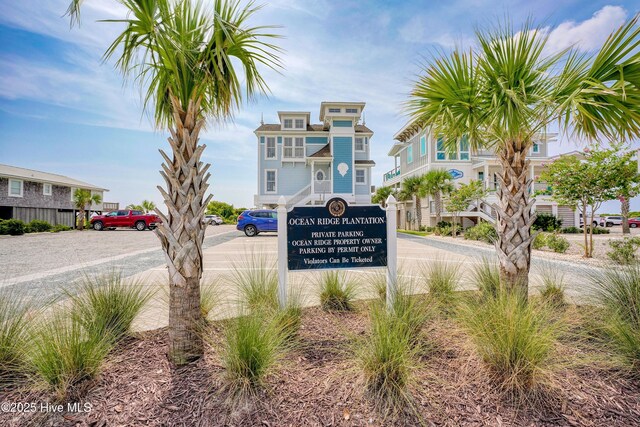 6865 Beckman Cir SW Unit 53, Ocean Isle Beach, NC 28469 - pool at dusk with a patio and a community pool
