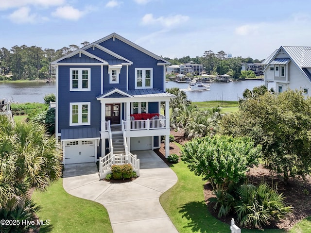 2821 Harborside Way, Southport, NC 28461 - beach home featuring a water view, a standing seam roof, stairs, and a garage