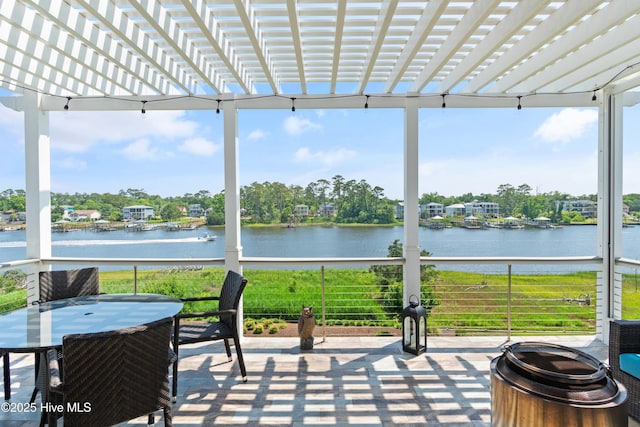 2821 Harborside Way, Southport, NC 28461 - sunroom / solarium with a water view, outdoor dining space, healthy amount of natural light, and floor to ceiling windows