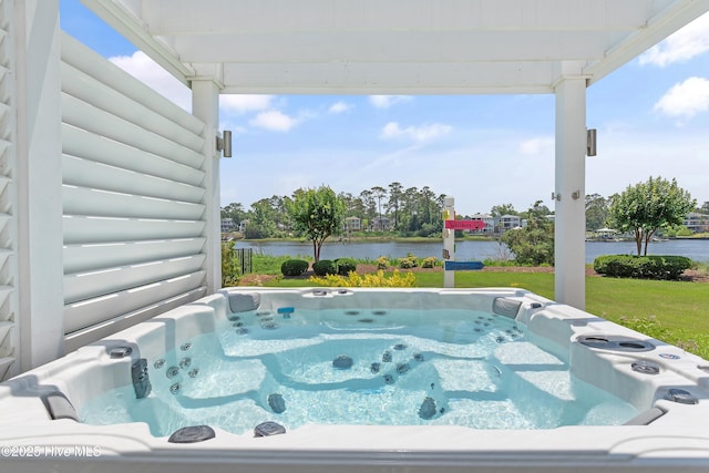 2821 Harborside Way, Southport, NC 28461 - view of pool with a hot tub, a water view, and a yard