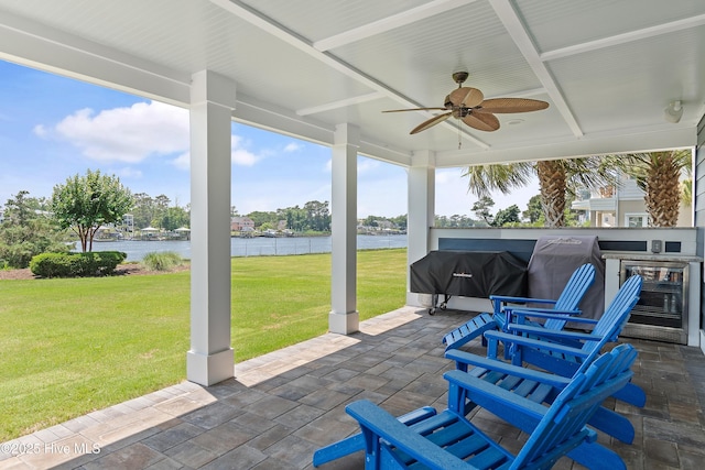 2821 Harborside Way, Southport, NC 28461 - view of patio with a water view, ceiling fan, and area for grilling