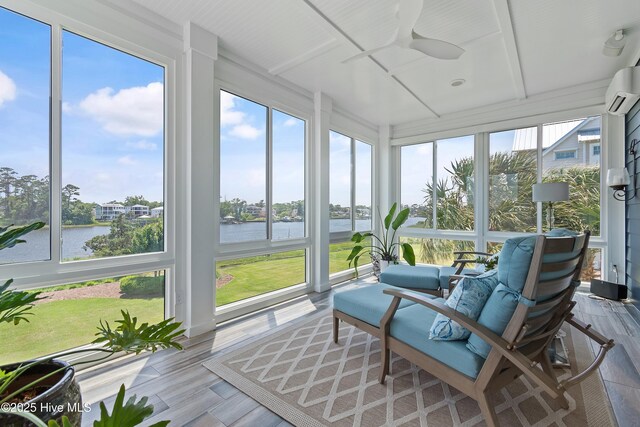 2821 Harborside Way, Southport, NC 28461 - sunroom / solarium featuring a water view, an AC wall unit, and wood finished floors