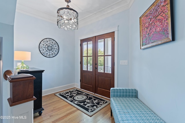 2821 Harborside Way, Southport, NC 28461 - foyer entrance featuring crown molding, wood finished floors, french doors, a chandelier, and baseboards