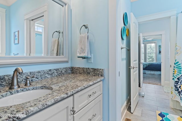 2821 Harborside Way, Southport, NC 28461 - ensuite bathroom featuring vanity, baseboards, and a ceiling fan