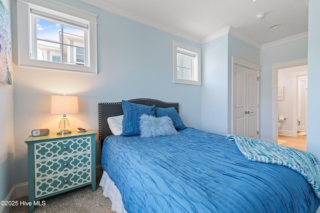 2821 Harborside Way, Southport, NC 28461 - bedroom with ornamental molding, baseboards, and a closet