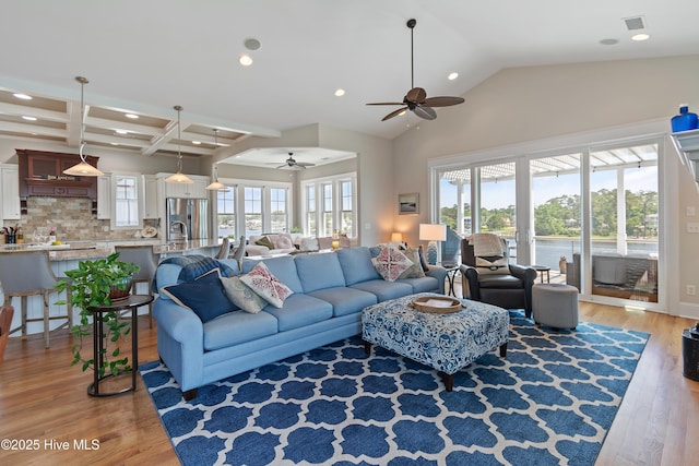 2821 Harborside Way, Southport, NC 28461 - living area with ceiling fan, light wood finished floors, recessed lighting, and coffered ceiling