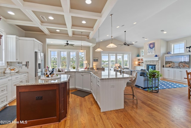 2821 Harborside Way, Southport, NC 28461 - kitchen featuring a ceiling fan, open floor plan, a spacious island, light wood-style flooring, and recessed lighting