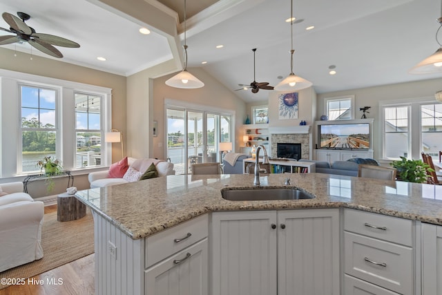 2821 Harborside Way, Southport, NC 28461 - kitchen featuring open floor plan, a sink, ceiling fan, light wood finished floors, and recessed lighting