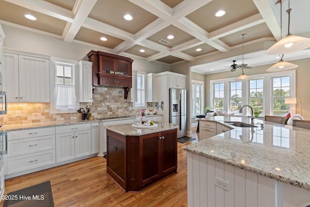 2821 Harborside Way, Southport, NC 28461 - kitchen featuring a sink, a large island, stainless steel fridge with ice dispenser, coffered ceiling, and a ceiling fan