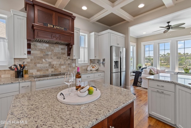 2821 Harborside Way, Southport, NC 28461 - kitchen featuring stainless steel refrigerator with ice dispenser, ceiling fan, backsplash, crown molding, and beamed ceiling