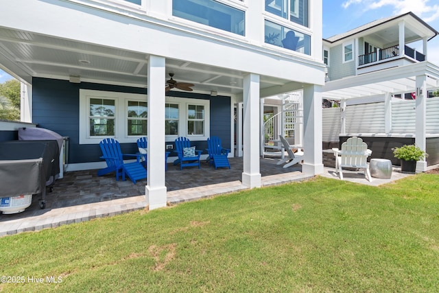 2821 Harborside Way, Southport, NC 28461 - view of patio / terrace featuring a jacuzzi, ceiling fan, an outdoor living space, and stairs
