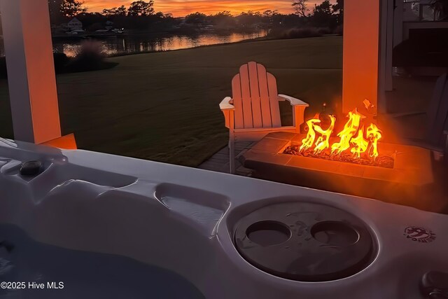 2821 Harborside Way, Southport, NC 28461 - exterior space featuring an outdoor fire pit and a water view