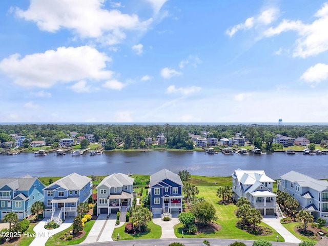 2821 Harborside Way, Southport, NC 28461 - aerial view of residential area featuring a large body of water and a tree filled landscape