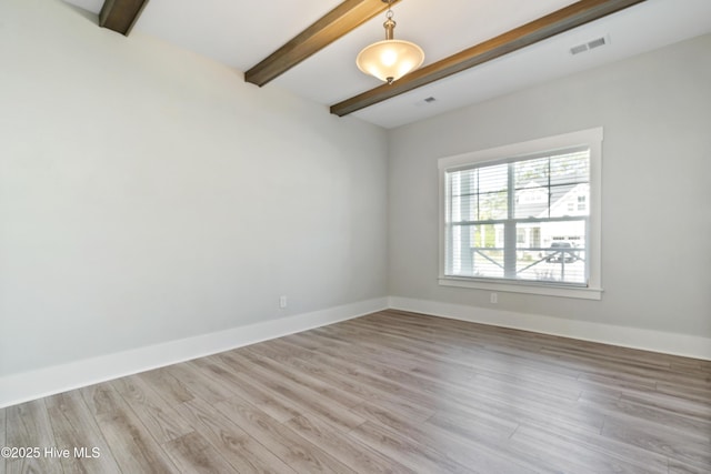 1331 Landover Dr SW, Ocean Isle Beach, NC 28469 - empty room featuring beamed ceiling, wood finished floors, and baseboards