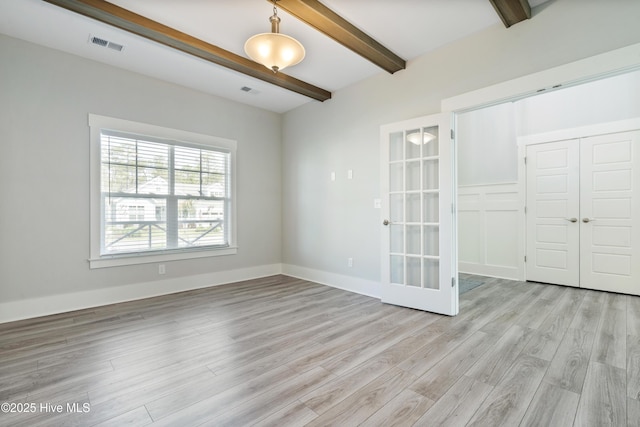 1331 Landover Dr SW, Ocean Isle Beach, NC 28469 - unfurnished room with beamed ceiling, light wood-style flooring, french doors, and baseboards