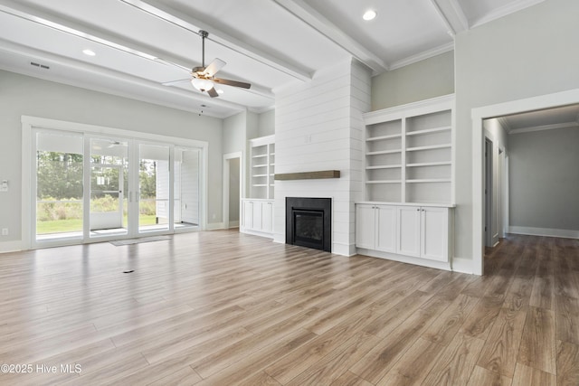 1331 Landover Dr SW, Ocean Isle Beach, NC 28469 - unfurnished living room with ceiling fan, light wood-style flooring, baseboards, beamed ceiling, and crown molding