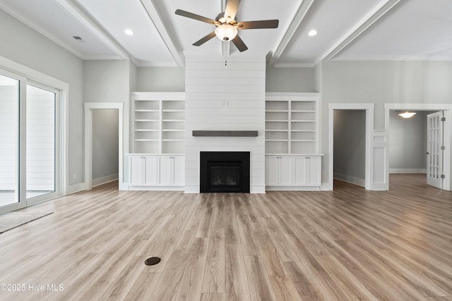 1331 Landover Dr SW, Ocean Isle Beach, NC 28469 - unfurnished living room with ceiling fan, beamed ceiling, baseboards, light wood finished floors, and a fireplace