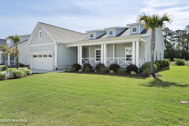 1331 Landover Dr SW, Ocean Isle Beach, NC 28469 - view of front of home with board and batten siding, a porch, a front lawn, and a shingled roof