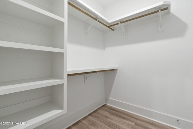 1331 Landover Dr SW, Ocean Isle Beach, NC 28469 - walk in closet featuring wood finished floors