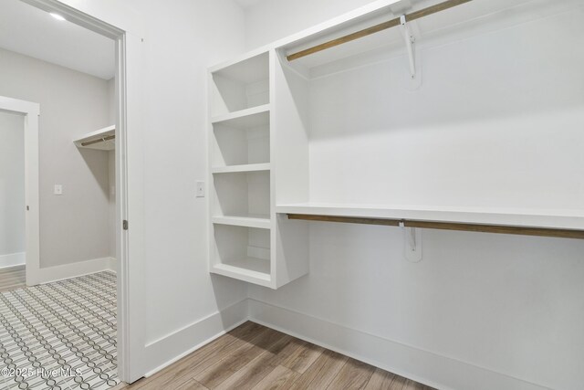 1331 Landover Dr SW, Ocean Isle Beach, NC 28469 - walk in closet featuring light wood-style floors