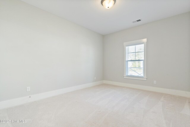 1331 Landover Dr SW, Ocean Isle Beach, NC 28469 - spare room featuring light colored carpet and baseboards