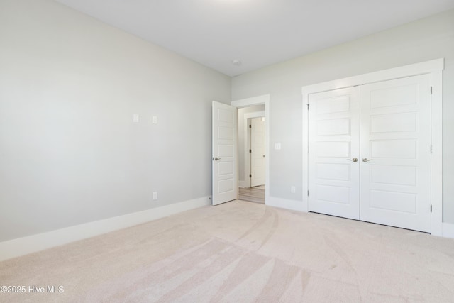 1331 Landover Dr SW, Ocean Isle Beach, NC 28469 - unfurnished bedroom featuring carpet floors, a closet, and baseboards