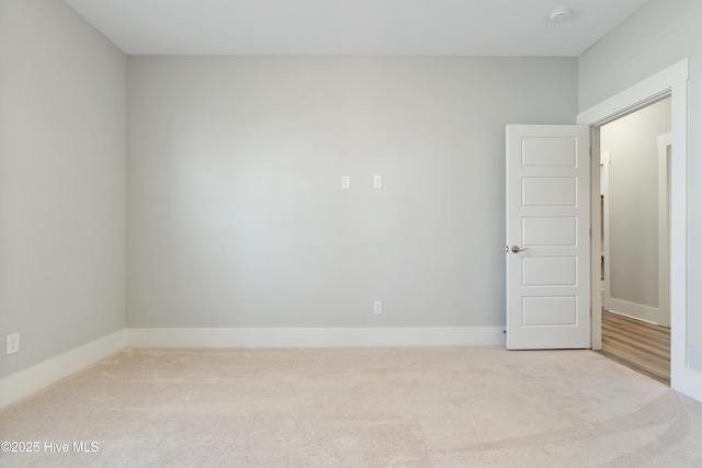 1331 Landover Dr SW, Ocean Isle Beach, NC 28469 - empty room featuring carpet, a smoke detector, and baseboards