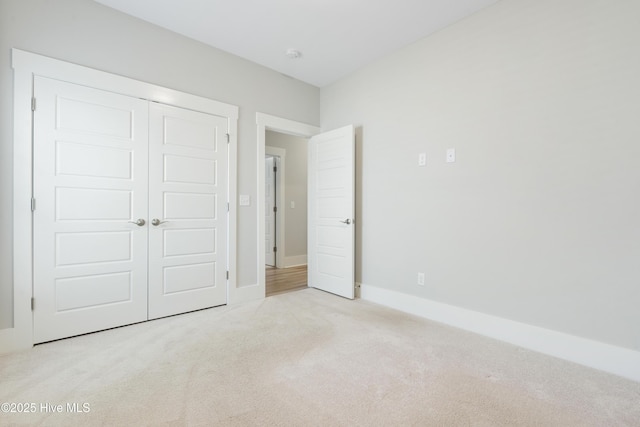1331 Landover Dr SW, Ocean Isle Beach, NC 28469 - unfurnished bedroom with carpet, a closet, and baseboards