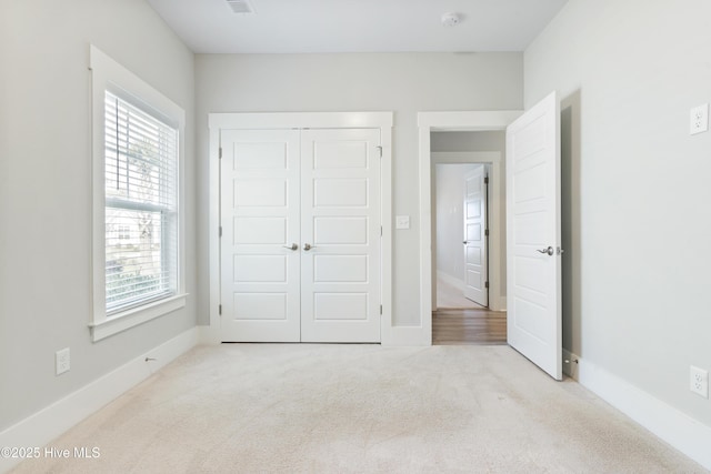 1331 Landover Dr SW, Ocean Isle Beach, NC 28469 - unfurnished bedroom with carpet floors, a closet, and baseboards