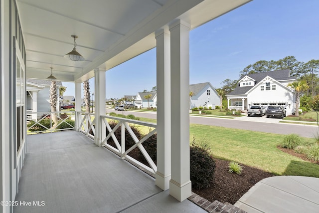 1331 Landover Dr SW, Ocean Isle Beach, NC 28469 - porch with a residential view and a yard