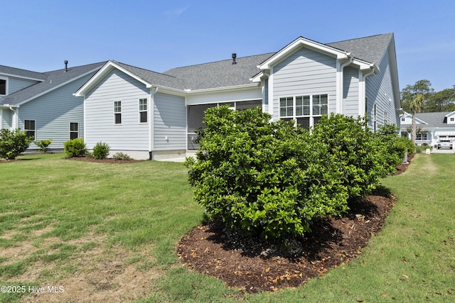 1331 Landover Dr SW, Ocean Isle Beach, NC 28469 - rear view of house with a lawn and a shingled roof