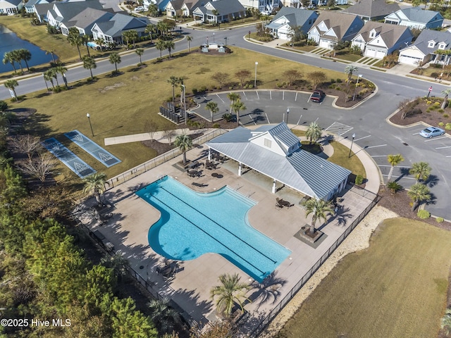 1331 Landover Dr SW, Ocean Isle Beach, NC 28469 - aerial perspective of suburban area featuring a pool area and a nearby body of water