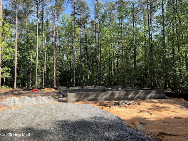1057 Greenbriar Dr, Vass, NC 28394 - view of road featuring a forest view