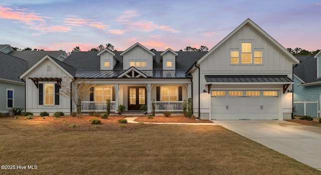 580 Jackline Dr, Hampstead, NC 28443 - modern inspired farmhouse with board and batten siding, a standing seam roof, covered porch, and metal roof