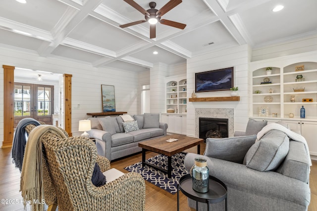 580 Jackline Dr, Hampstead, NC 28443 - living area with ornamental molding, ceiling fan, wood finished floors, coffered ceiling, and a glass covered fireplace