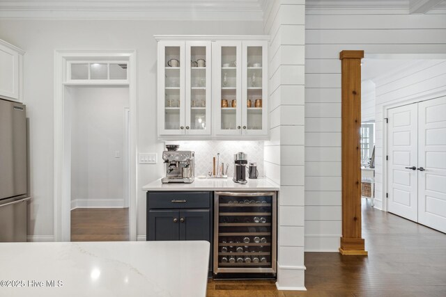 580 Jackline Dr, Hampstead, NC 28443 - bar with crown molding, freestanding refrigerator, tasteful backsplash, wine cooler, and dark wood-style floors