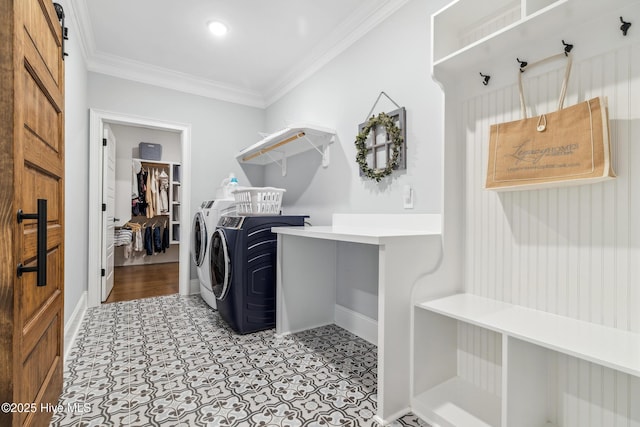 580 Jackline Dr, Hampstead, NC 28443 - clothes washing area with laundry area, crown molding, light floors, baseboards, and washer and clothes dryer