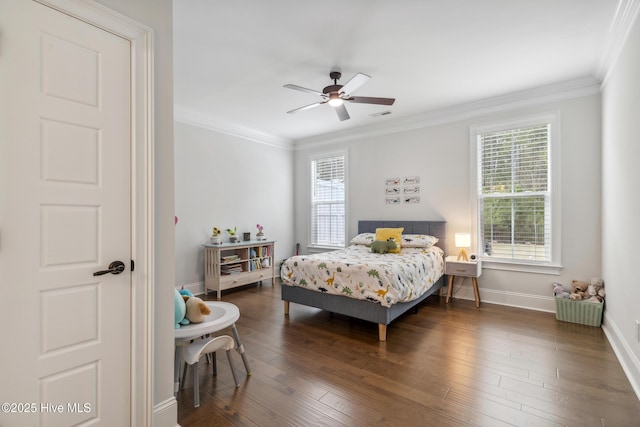 580 Jackline Dr, Hampstead, NC 28443 - bedroom with visible vents, baseboards, ornamental molding, a ceiling fan, and wood finished floors
