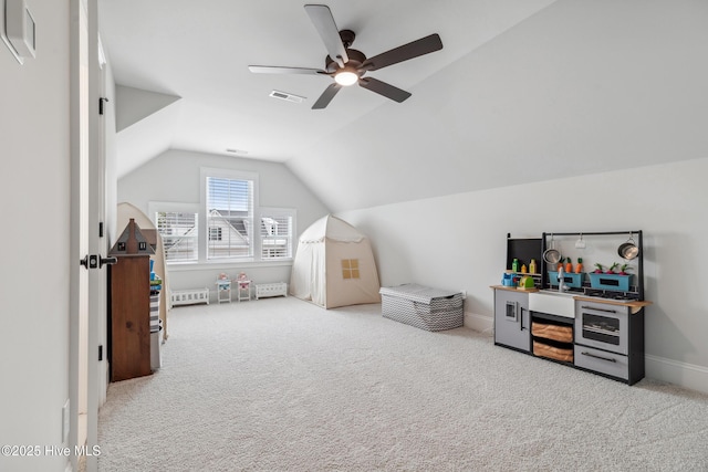 580 Jackline Dr, Hampstead, NC 28443 - interior space featuring baseboards, vaulted ceiling, visible vents, ceiling fan, and carpet