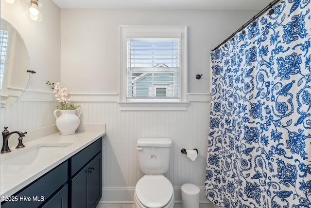 580 Jackline Dr, Hampstead, NC 28443 - bathroom featuring toilet, a wainscoted wall, curtained shower, and vanity