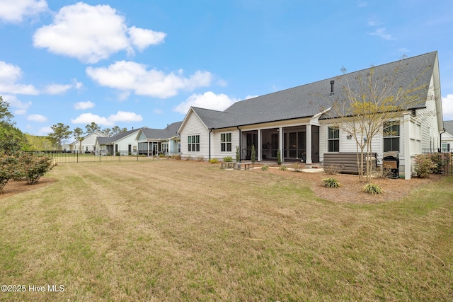 580 Jackline Dr, Hampstead, NC 28443 - rear view of property with a yard, fence, a sunroom, and roof with shingles