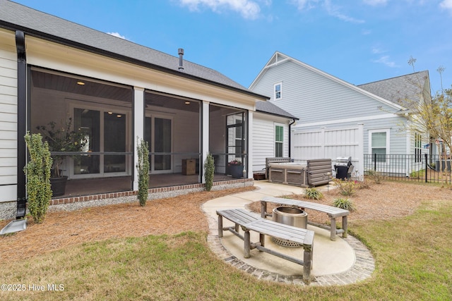 580 Jackline Dr, Hampstead, NC 28443 - back of house featuring a sunroom, a yard, a patio area, fence, and a jacuzzi