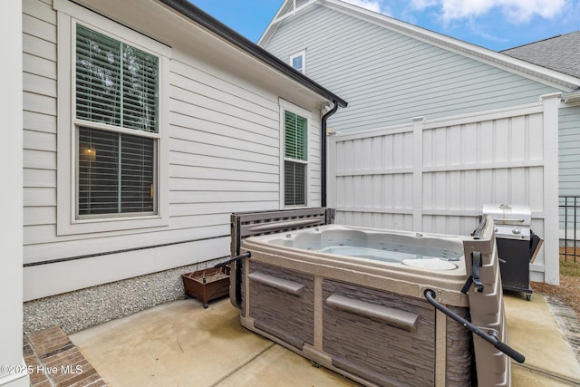 580 Jackline Dr, Hampstead, NC 28443 - view of patio / terrace with a grill and a hot tub