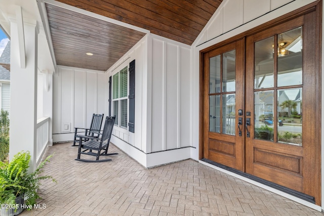 580 Jackline Dr, Hampstead, NC 28443 - exterior space with board and batten siding, french doors, and covered porch