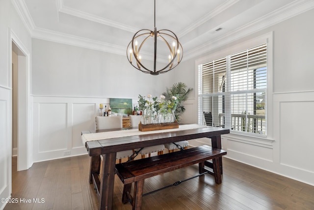 580 Jackline Dr, Hampstead, NC 28443 - dining room with dark wood-type flooring, a decorative wall, and a notable chandelier