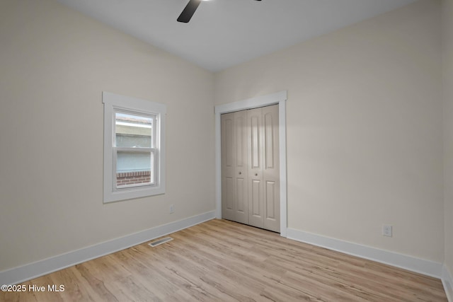 608 S 14th St, Wilmington, NC 28401 - unfurnished bedroom featuring ceiling fan, visible vents, baseboards, a closet, and light wood-style flooring