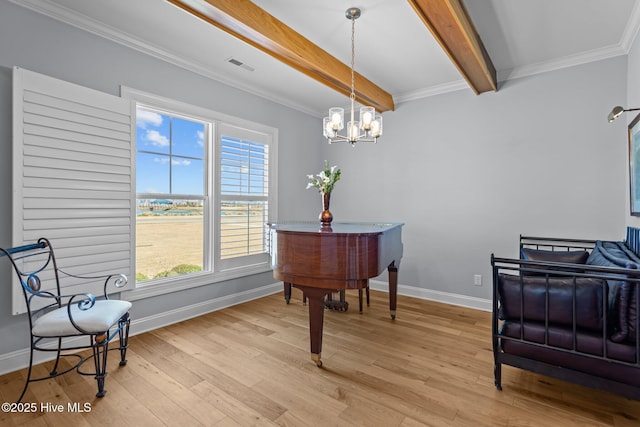 living area featuring baseboards, beam ceiling, visible vents, and light wood-style floors