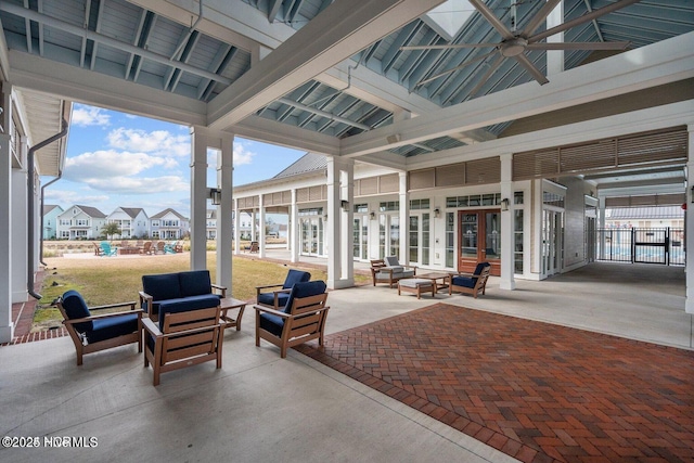 view of patio / terrace featuring french doors, fence, and an outdoor living space
