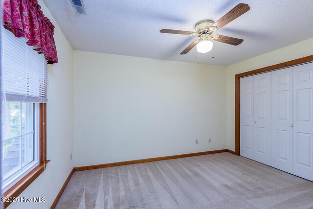138 Stonebridge Trl, Havelock, NC 28532 - unfurnished bedroom with baseboards, light carpet, a closet, and visible vents