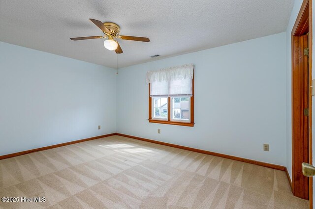 138 Stonebridge Trl, Havelock, NC 28532 - carpeted spare room featuring a textured ceiling, visible vents, baseboards, and ceiling fan